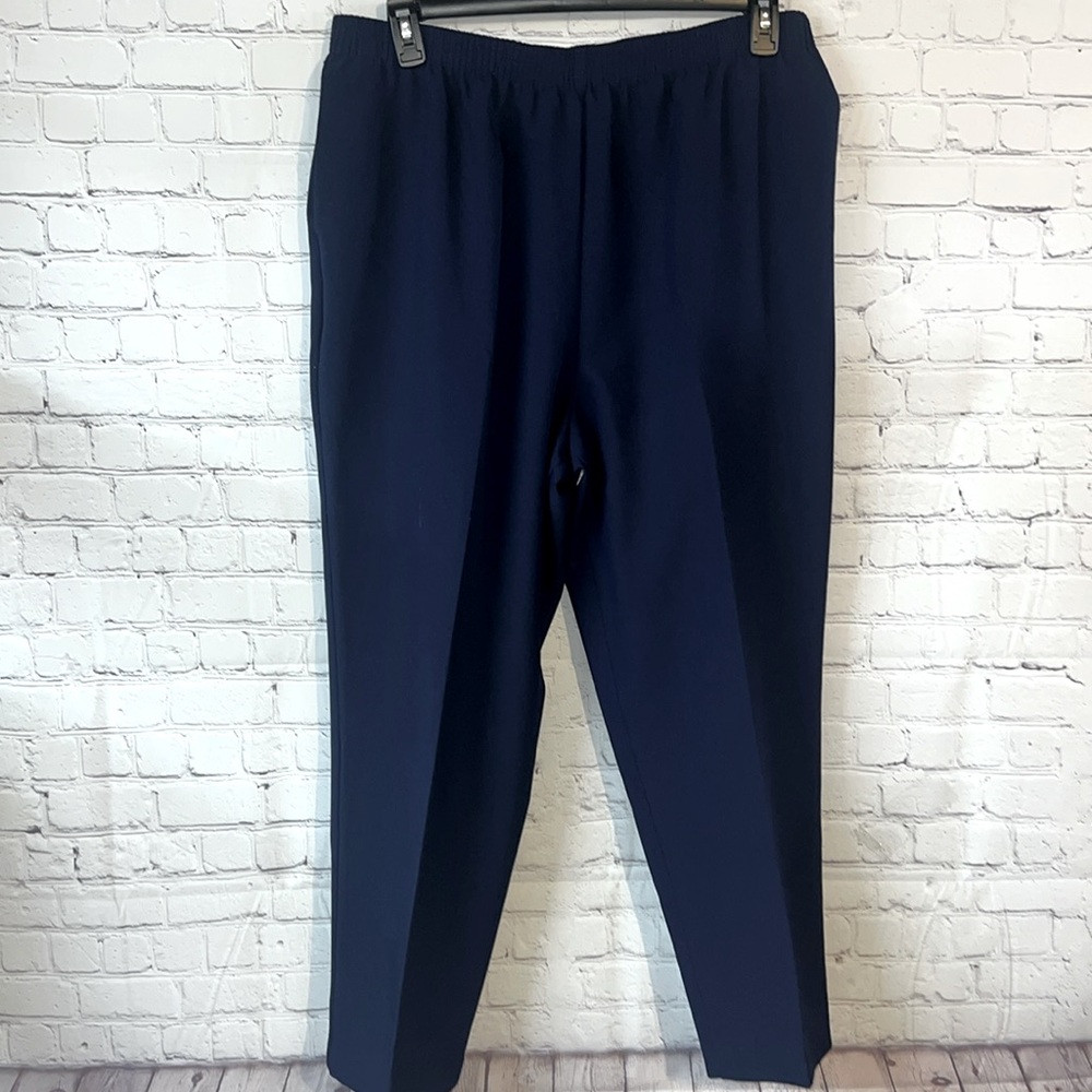 Size 18 Navy elastic waist polyester slacks. Two side slit pockets. Plai…